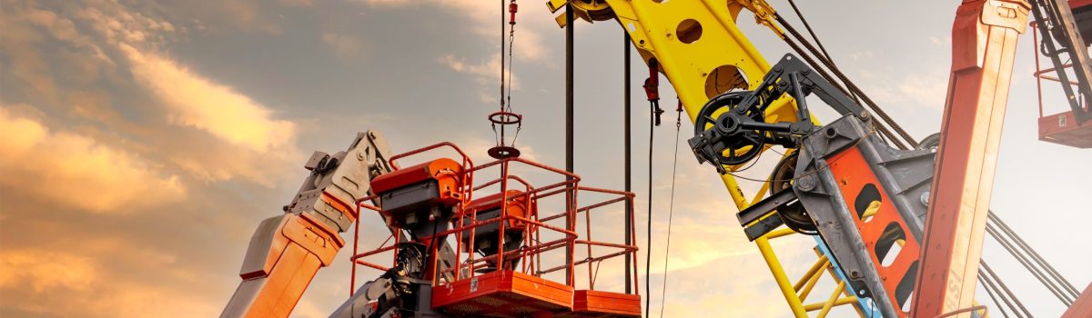 Articulated boom lift. Aerial platform lift and construction crane with sunset sky. Mobile construction crane for rent and sale. Maintenance and repair hydraulic boom lift service. Crane dealership.