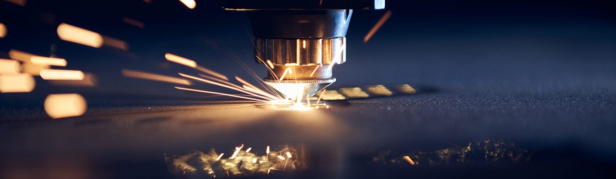 CNC Laser cutting of metal close up, modern industrial technology. Small depth of field.